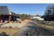 Expansive property with brick home featuring screened porch, carport, and additional covered parking for RV at 3618 Highway 430, Nichols, SC 29581
