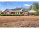 Charming brick home with a manicured lawn and porte-cochère, perfect for outdoor entertaining at 3618 Highway 430, Nichols, SC 29581