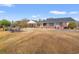 Expansive property featuring a brick home with a carport, screened porch, and outdoor patio with picnic table at 3618 Highway 430, Nichols, SC 29581