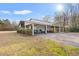 Large outbuilding with covered parking for multiple vehicles or equipment, enhancing property functionality at 3618 Highway 430, Nichols, SC 29581