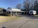 Outbuilding with covered parking and storage space for vehicles and equipment, adding to property's utility at 3618 Highway 430, Nichols, SC 29581