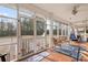 Relaxing screened porch with views of the backyard, tile flooring, and comfortable seating at 3618 Highway 430, Nichols, SC 29581