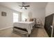 Cozy bedroom featuring a bed, nightstand, and window, perfect for relaxation at 404 Cattle Drive Circle, Myrtle Beach, SC 29588