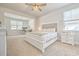Spacious bedroom features a decorative headboard, ceiling fan, carpeted floors, and adjacent office space at 404 Cattle Drive Circle, Myrtle Beach, SC 29588