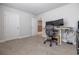 Bright office featuring carpeting, modern chair, and two wall mounted monitors at 404 Cattle Drive Circle, Myrtle Beach, SC 29588