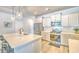 Bright kitchen with white cabinetry, stainless steel appliances, and a center island with seating at 404 Cattle Drive Circle, Myrtle Beach, SC 29588