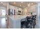 Modern kitchen with a large island, stainless steel appliances, and white cabinets at 404 Cattle Drive Circle, Myrtle Beach, SC 29588