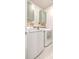 Clean laundry room features cabinets, modern washer and dryer, and decor at 404 Cattle Drive Circle, Myrtle Beach, SC 29588