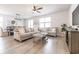 Cozy living room with comfortable seating, a ceiling fan, and a view of the dining area at 404 Cattle Drive Circle, Myrtle Beach, SC 29588