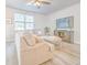 Bright living room with hardwood floors, comfortable seating, and a large window overlooking the yard at 404 Cattle Drive Circle, Myrtle Beach, SC 29588