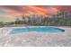 Enjoy the community pool with brick deck and colorful sunset views at 404 Cattle Drive Circle, Myrtle Beach, SC 29588