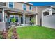 Backyard with a covered patio area, a well-maintained lawn, and tidy landscaping at 4123 Mclamb Ave. # 4123, Little River, SC 29566