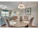 Bright dining area with a round table, seating for four, and seamless access to the living room at 4123 Mclamb Ave. # 4123, Little River, SC 29566