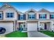 Attractive townhomes with individual garages, cozy porches, and manicured lawns at 4123 Mclamb Ave. # 4123, Little River, SC 29566