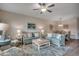 Comfortable living room with coastal decor, plush seating, ceiling fan, and an adjacent dining area at 4123 Mclamb Ave. # 4123, Little River, SC 29566