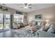 Inviting living room with comfortable seating, lots of natural light, and sliding door access to the outside at 4123 Mclamb Ave. # 4123, Little River, SC 29566