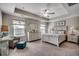 Spacious main bedroom with a tray ceiling, neutral tones, and coastal-inspired decor at 4123 Mclamb Ave. # 4123, Little River, SC 29566