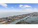 Aerial view showcasing oceanfront and waterfront homes with docks and pools in a coastal community at 414 S Dogwood Dr., Garden City Beach, SC 29576