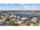 Aerial view of waterfront homes with docks on a canal that leads to expansive waterways at 414 S Dogwood Dr., Garden City Beach, SC 29576