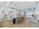 Spacious kitchen featuring a center island with seating and bright cabinets with stainless appliances at 414 S Dogwood Dr., Garden City Beach, SC 29576
