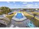 Backyard pool with views of the water, featuring a patio area and manicured landscaping at 414 S Dogwood Dr., Garden City Beach, SC 29576