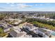Aerial view of a condo community with pond, parking, trees and lush landscaping at 4142 Hibiscus Dr. # 104, Little River, SC 29566