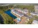 A breathtaking aerial view of the condo complex with a beautiful lake and outdoor pool at 4142 Hibiscus Dr. # 104, Little River, SC 29566