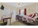 Floral themed bedroom with carpet, dresser, table and twin closets at 4142 Hibiscus Dr. # 104, Little River, SC 29566