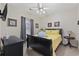 Cozy bedroom with a dark wood bed frame, side table, and carpeted flooring at 4142 Hibiscus Dr. # 104, Little River, SC 29566