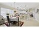 Open concept dining and kitchen area with tile floors and ample natural light at 4142 Hibiscus Dr. # 104, Little River, SC 29566