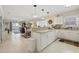 Open-concept kitchen with a breakfast bar, seamlessly connecting to the dining and living areas at 4142 Hibiscus Dr. # 104, Little River, SC 29566