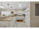 Functional kitchen with white cabinetry, a breakfast bar, and plenty of countertop space at 4142 Hibiscus Dr. # 104, Little River, SC 29566