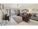 Comfortable living room featuring tile flooring, a ceiling fan, and a sliding glass door leading outside at 4142 Hibiscus Dr. # 104, Little River, SC 29566