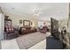 Spacious living room with tile flooring, ceiling fan, and comfortable leather seating at 4142 Hibiscus Dr. # 104, Little River, SC 29566