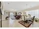 Inviting living space with neutral tones, tile floors, and access to a private outdoor area at 4142 Hibiscus Dr. # 104, Little River, SC 29566