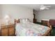 Cozy bedroom featuring a colorful bedspread, matching nightstand, and a ceiling fan at 4243 Rivergate Ln., Little River, SC 29566