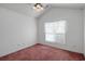 Bright bedroom with vaulted ceiling, a ceiling fan, and a large window at 4243 Rivergate Ln., Little River, SC 29566