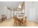 Bright dining area with a chandelier, adjacent kitchen, and space for a round table with seating at 4243 Rivergate Ln., Little River, SC 29566