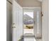 Inviting entryway showcases the home's exterior through a glass-paneled front door and a storm door at 4243 Rivergate Ln., Little River, SC 29566