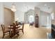 Bright, open living room featuring vaulted ceilings, a fireplace, and a decorative chandelier at 4243 Rivergate Ln., Little River, SC 29566