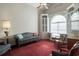 A cozy living room with a vaulted ceiling, built-in cabinets, and a window seat at 4243 Rivergate Ln., Little River, SC 29566