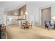Open-concept living area with a dining table, flowing into a well-equipped kitchen area at 4243 Rivergate Ln., Little River, SC 29566
