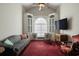 Inviting living room with built-in cabinets, a large window, and comfortable seating at 4243 Rivergate Ln., Little River, SC 29566
