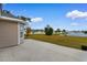 Landscaped backyard with pond view and water fountain, visible from concrete patio area at 4387 Heartwood Ln., Myrtle Beach, SC 29579