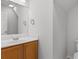 Bright bathroom with wood cabinet, modern mirror, and chrome hardware at 4387 Heartwood Ln., Myrtle Beach, SC 29579