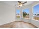Sunny breakfast nook boasts beautiful tile floors, a ceiling fan, and scenic views of the backyard lake at 4387 Heartwood Ln., Myrtle Beach, SC 29579