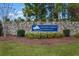 Stone entrance to Walker's Woods at Carolina Forest welcomes you with lush landscaping and a beautiful sign at 4387 Heartwood Ln., Myrtle Beach, SC 29579