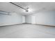 Spacious garage with two white doors, neutral walls, and ample room for parking and storage at 4387 Heartwood Ln., Myrtle Beach, SC 29579