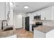 Stylish kitchen with stainless steel appliances, granite countertops, sleek black hardware and tile flooring at 4387 Heartwood Ln., Myrtle Beach, SC 29579