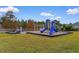 Community playground featuring slides, swings, and play structures in a well-maintained area at 4387 Heartwood Ln., Myrtle Beach, SC 29579